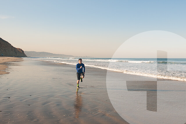 Photo of a man in athletic clothing on a beach
